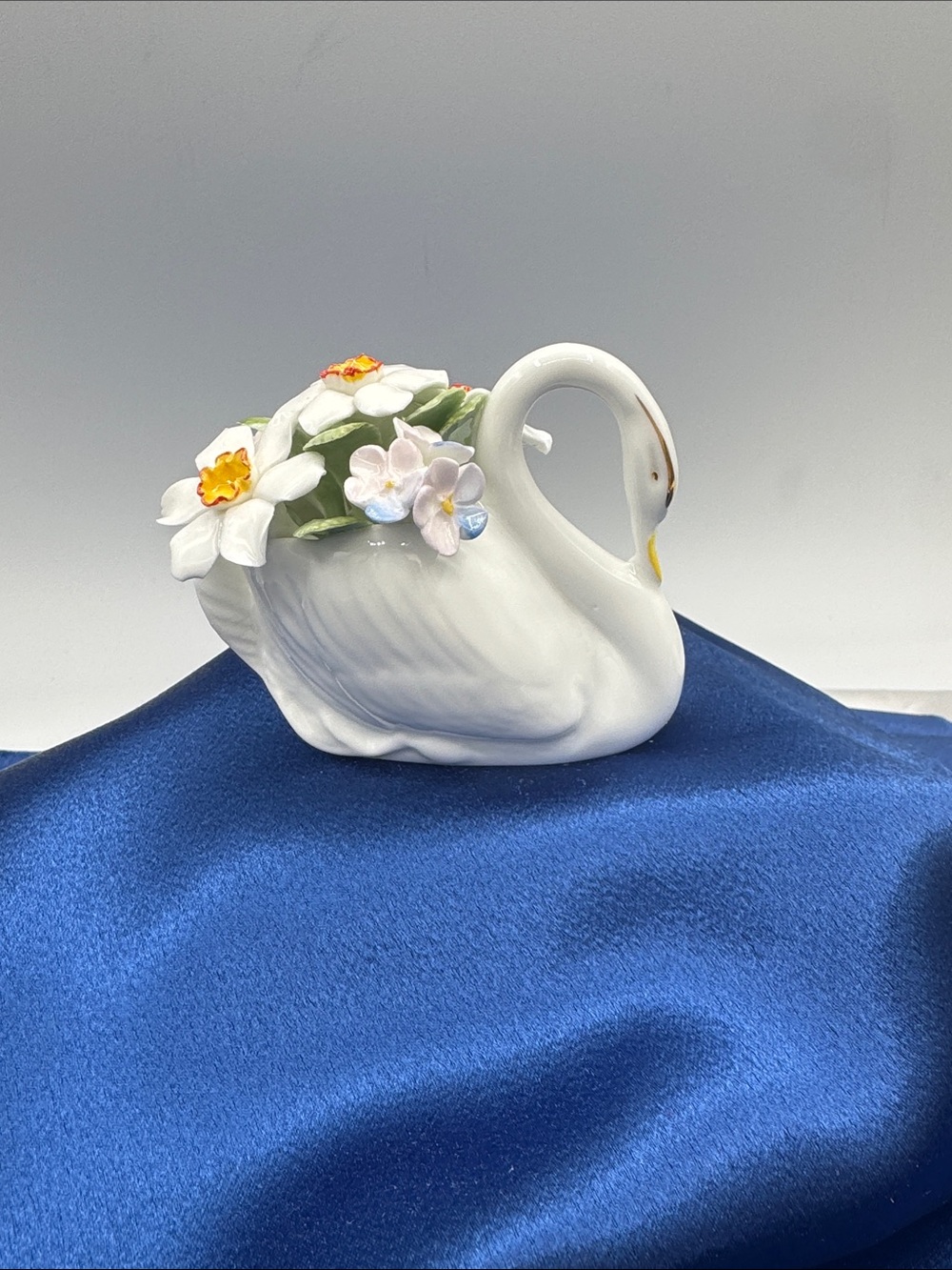 Royal Doulton fine bone china "Swan with Flowers" figurine, made in England.